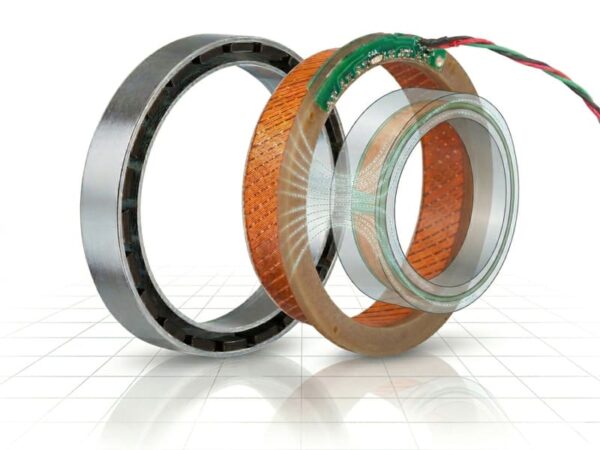 Extreme macro shot of the internal skewed stator and neodymium rotor interface of an IHS Smart Drive robotics motor, demonstrating precision dynamic balancing for zero-cogging and ultra-smooth motion.